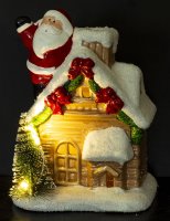 Haus mit Weihnachtsmann und LED-Beleuchtung