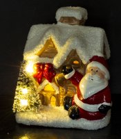Haus mit Weihnachtsmann und LED-Beleuchtung